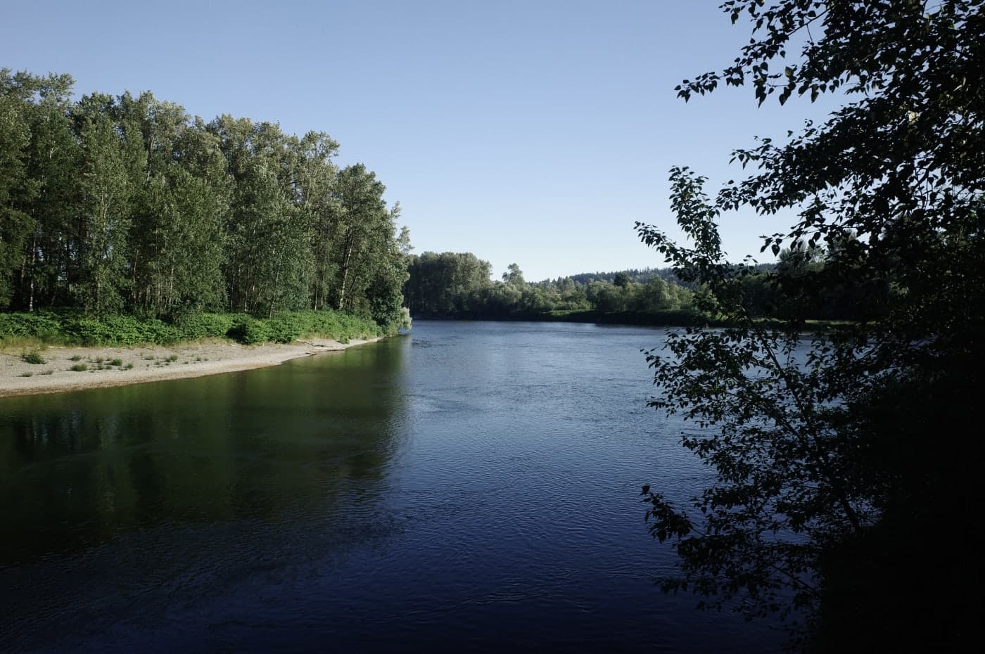 A scenic river view along a hiking trail.